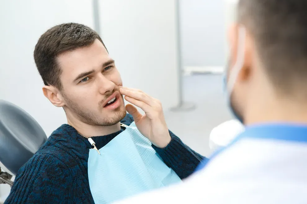 man-holding-swollen-jaw