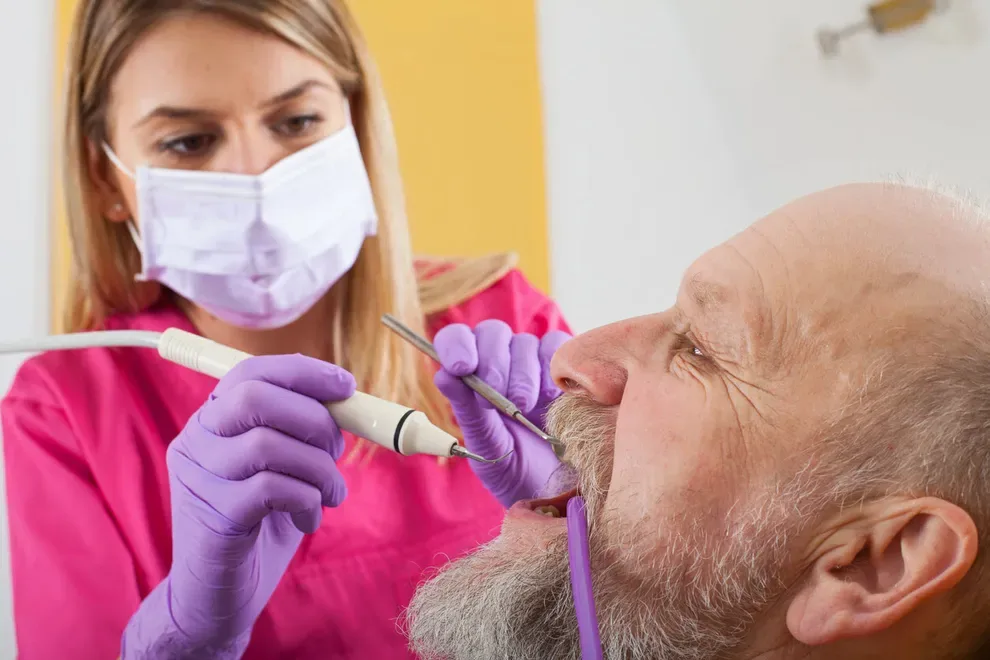 older-man-getting-teeth-cleaned